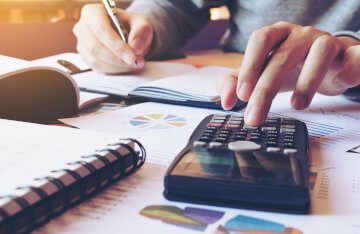 Image of accountant doing taxes by Miami Accounting Services